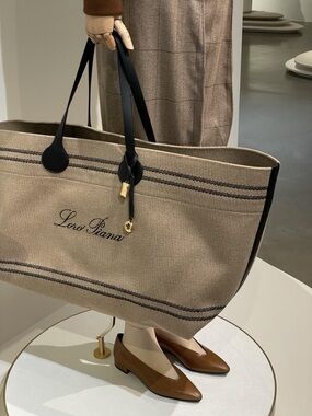 Loro Piana Beige Canvas Tote with Black Leather Handles and Gold Charm